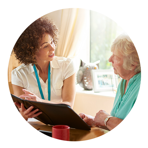 nurse helping senior woman